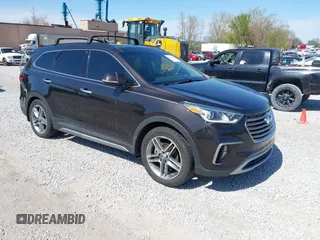2017 Hyundai Santa Fe SE Ultimate z VIN KM8SR4HFXHU231793, wystawiony jako IAAI lot #41963670 z przebiegiem 132 658 mil mil oraz . Historia ofert i sprzedaży dostępna na DreamBid. Obrazek 1.