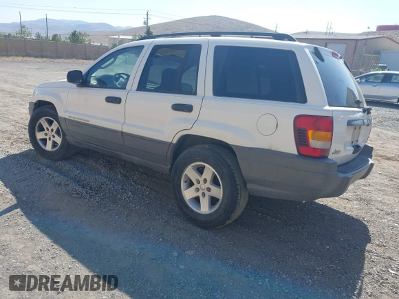 2004 Jeep Grand Cherokee Laredo with VIN 1J4GX48SX4C151160, listed as a IAAI auction lot 42765441 with 176,179 mi miles and . Bid and sale history available at DreamBid. Image 3.