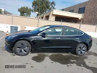 2019 Tesla Model 3 Mid Range with VIN 5YJ3E1EA2KF305834, listed as a IAAI auction lot 41719610 with 126,333 mi miles and . Bid and sale history available at DreamBid. Image 14.
