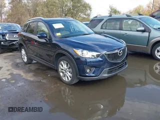 2015 Mazda CX-5 Grand Touring with VIN JM3KE4DY7F0478823, listed as a IAAI auction lot 40731626 with 82,884 mi miles. Bid and sale history available at carsss.com. Image 1.