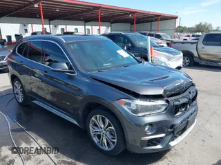 2017 BMW X1 xDrive28i with VIN WBXHT3Z33H4A65198, listed as a IAAI auction lot 41798503 with 88,951 mi miles. Bid and sale history available at carsss.com. Image 1.