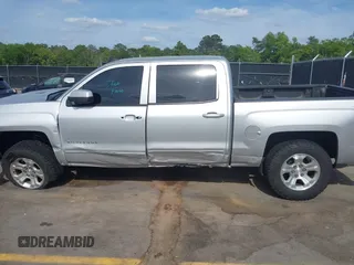2017 Chevrolet Silverado 1500 LT with VIN 3GCUKREC5HG285689, listed as a IAAI auction lot 42055959 with 128,237 mi miles and . Bid and sale history available at DreamBid. Image 14.