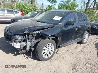 2014 Mazda CX-5 Touring z VIN JM3KE4CY4E0328880, wystawiony jako IAAI lot #42112302 z przebiegiem 185 228 mil mil oraz . Historia ofert i sprzedaży dostępna na DreamBid. Obrazek 2.