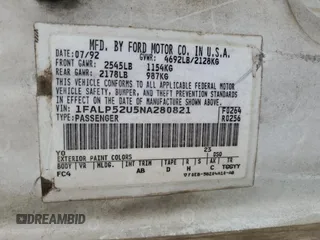 1992 Ford Taurus GL z VIN 1FALP52U5NA280821, wystawiony jako Copart lot #77457304 z przebiegiem 33 484 mil mil oraz Szkoda całkowita • Salvage title. Historia ofert i sprzedaży dostępna na DreamBid. Obrazek 12.
