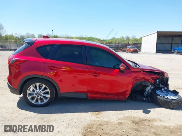 2015 Mazda CX-5 Grand Touring with VIN JM3KE4DY5F0469439, listed as a IAAI auction lot 42053851 with 70,676 mi miles. Bid and sale history available at carsss.com. Image 13.
