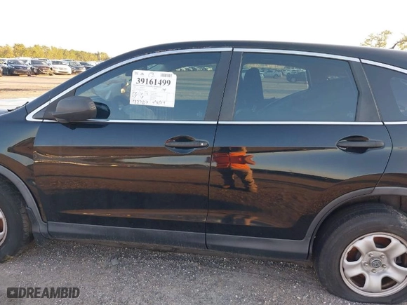 2015 Honda CR-V LX with VIN 2HKRM3H38FH512323, listed as a IAAI auction lot 39161499 with 133,787 mi miles. Bid and sale history available at carsss.com. Image 15.