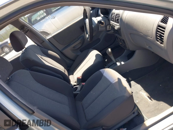 2005 Hyundai Accent GLS with VIN KMHCG45C75U658672, listed as a IAAI auction lot 42107140 with 34,351 mi miles. Bid and sale history available at carsss.com. Image 5.