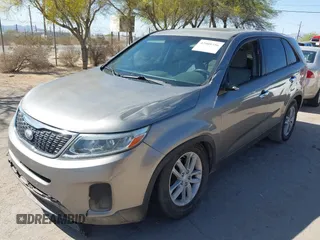 2014 Kia Sorento LX with VIN 5XYKT3A6XEG480411, listed as a IAAI auction lot 42008356 with 137,435 mi miles and . Bid and sale history available at DreamBid. Image 2.