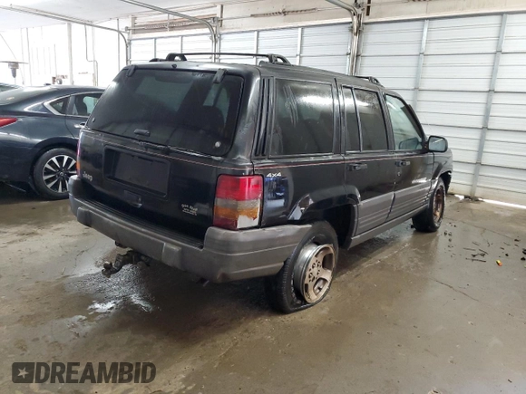 1996 Jeep Grand Cherokee Laredo with VIN 1J4GZ58S0TC402024, listed as a Copart auction lot 65074774 with 163,477 mi miles and Salvage Title. Bid and sale history available at carsss.com. Image 3.