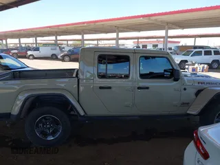 2022 Jeep Gladiator Rubicon with VIN 1C6JJTBG2NL164117, listed as a IAAI auction lot 42450350 with 22,326 mi miles and . Bid and sale history available at DreamBid. Image 13.