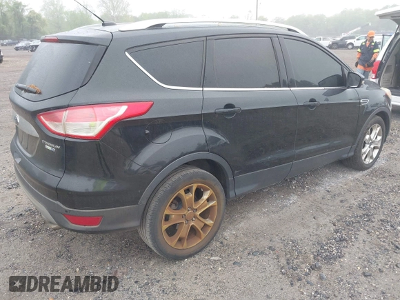 2014 Ford Escape Titanium with VIN 1FMCU9J90EUC24898, listed as a IAAI auction lot 42166523 with 152,464 mi miles and . Bid and sale history available at DreamBid. Image 4.