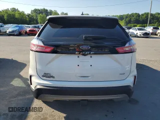 2021 Ford Edge SEL с VIN 2FMPK4J91MBA41475, выставлен на аукционе Copart как лот 63185385 с пробегом 46 639 миль миль и Списание • Salvage title. История ставок и продаж доступна на DreamBid. Изображение 6.