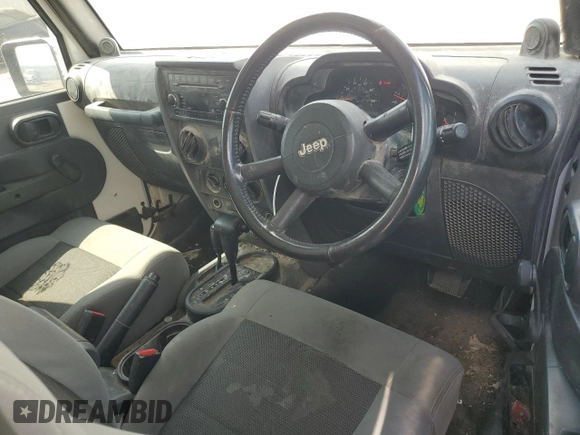 2008 Jeep Wrangler X с VIN 1J4FZ24188L503312, выставлен на аукционе Copart как лот 62013324 с пробегом 174 344 миль миль и Списание • Salvage title. История ставок и продаж доступна на DreamBid. Изображение 8.