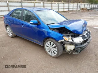 2010 Kia Forte SX with VIN KNAFW4A3XA5250341, listed as a IAAI auction lot 41698461 with 124,334 mi miles. Bid and sale history available at carsss.com. Image 1.