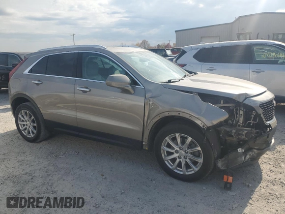 2022 Cadillac XT4 FWD Luxury with VIN 1GYAZAR4XNF121008, listed as a Copart auction lot 77599974 with 29,141 mi miles and Salvage title. Bid and sale history available at DreamBid. Image 4.