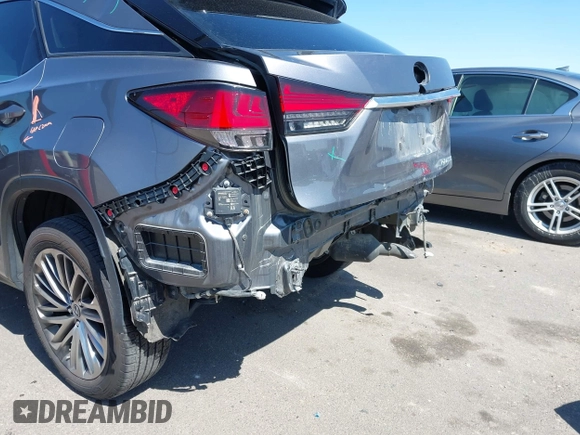 2020 Lexus RX 450h with VIN 2T2JGMDA2LC053394, listed as a IAAI auction lot 41979007 with 56,331 mi miles and . Bid and sale history available at DreamBid. Image 6.