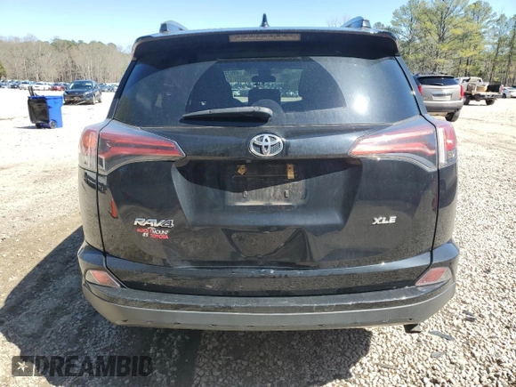 2018 Toyota RAV4 XLE with VIN 2T3WFREV7JW412348, listed as a Copart auction lot 49973215 with 127,661 mi miles and Salvage Title. Bid and sale history available at DreamBid. Image 6.