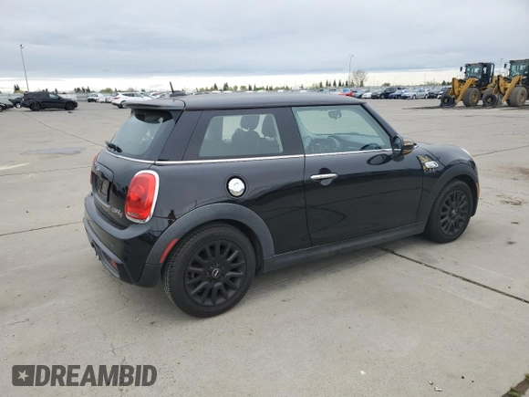 2014 MINI Hardtop S with VIN WMWXM7C57ET987069, listed as a Copart auction lot 52147955 with 121,276 mi miles and Salvage Title. Bid and sale history available at DreamBid. Image 3.