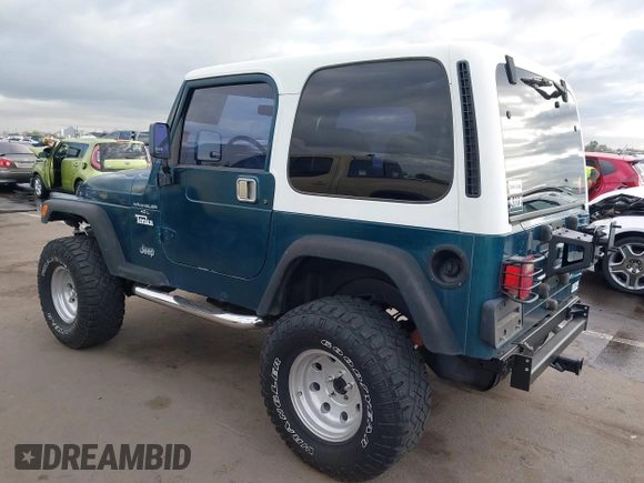 1998 Jeep Wrangler Sport with VIN 1J4FY19S7WP787679, listed as a IAAI auction lot 41764883 with 134,144 mi miles. Bid and sale history available at carsss.com. Image 3.