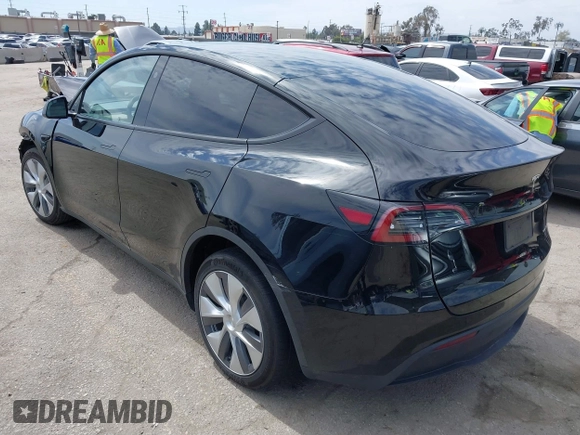 2023 Tesla Model Y Long Range z VIN 7SAYGDEE2PF863200, wystawiony jako IAAI lot #41805168 z przebiegiem 25 480 mil mil oraz . Historia ofert i sprzedaży dostępna na DreamBid. Obrazek 3.