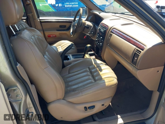 2000 Jeep Grand Cherokee Laredo z VIN 1J4G258S5YC237373, wystawiony jako IAAI lot #42736569 z przebiegiem 103 310 mil mil oraz . Historia ofert i sprzedaży dostępna na DreamBid. Obrazek 5.