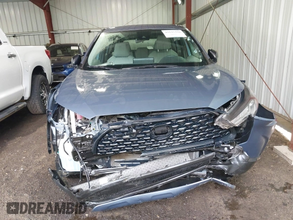2022 Toyota Corolla Cross L with VIN 7MUAAAAG9NV034659, listed as a IAAI auction lot 42125356 with 14,631 mi miles and . Bid and sale history available at DreamBid. Image 12.