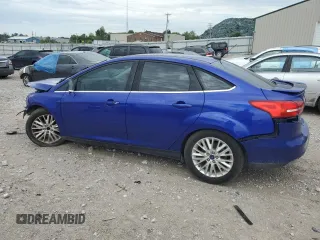 2015 Ford Focus Titanium z VIN 1FADP3J20FL299209, wystawiony jako Copart lot #67681504 z przebiegiem 98 711 mil mil oraz Nie do naprawy • Non repairable. Historia ofert i sprzedaży dostępna na DreamBid. Obrazek 2.
