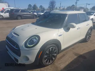 2021 MINI Hardtop 4 Door Cooper S with VIN WMWXU9C00M2P04693, listed as a IAAI auction lot 41785185 with 57,848 mi miles and . Bid and sale history available at DreamBid. Image 2.