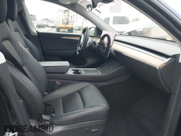 2023 Tesla Model Y Long Range with VIN 7SAYGDEE2PA024032, listed as a IAAI auction lot 41213403 with 23,418 mi miles and . Bid and sale history available at DreamBid. Image 5.