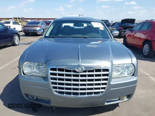 2006 Chrysler 300 C with VIN 2C3KA63H56H313967, listed as a IAAI auction lot 42056998 with 143,592 mi miles and . Bid and sale history available at carsss.com. Image 12.
