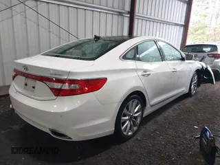2014 Hyundai Azera Limited with VIN KMHFH4JG7EA378755, listed as a IAAI auction lot 42027136 with 216,082 mi miles and . Bid and sale history available at carsss.com. Image 4.