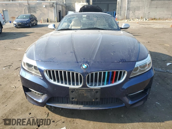 2014 BMW Z4 sDrive35is with VIN WBALM1C57EE634167, listed as a Copart auction lot 69088044 with 68,620 mi miles and Salvage title. Bid and sale history available at DreamBid. Image 5.
