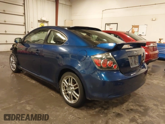 2009 Scion tC with VIN JTKDE167990297921, listed as a IAAI auction lot 41720687 with 159,960 mi miles. Bid and sale history available at carsss.com. Image 3.