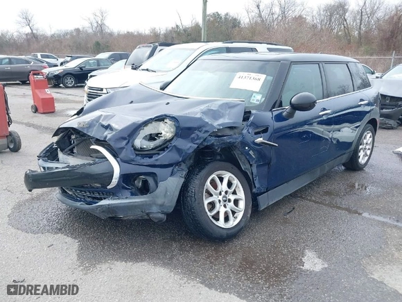 2016 MINI Cooper Clubman with VIN WMWLN5C54G2E30843, listed as a IAAI auction lot 41371368 with 1 mi miles. Bid and sale history available at carsss.com. Image 2.