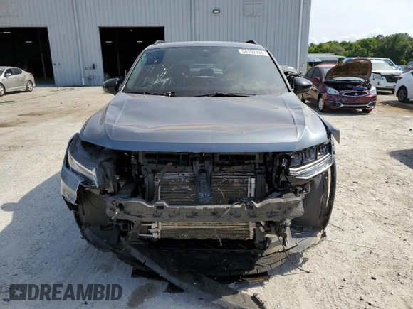 2022 Volkswagen Tiguan SE R-Line Black with VIN 3VVCB7AX6NM081880, listed as a Copart auction lot 54102735 with 52,010 mi miles and Salvage Title. Bid and sale history available at DreamBid. Image 5.