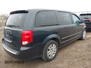 2014 Dodge Grand Caravan American Value with VIN 2C4RDGBG9ER463136, listed as a IAAI auction lot 41968032 with 184,138 mi miles and . Bid and sale history available at DreamBid. Image 4.