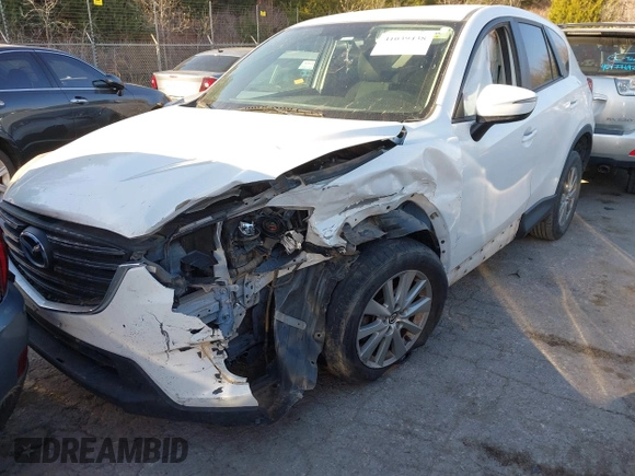 2016 Mazda CX-5 Touring z VIN JM3KE2CY9G0807688, wystawiony jako IAAI lot #41039438 z przebiegiem 169 483 mil mil oraz . Historia ofert i sprzedaży dostępna na DreamBid. Obrazek 18.