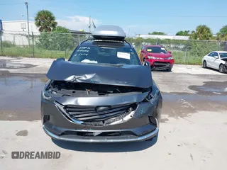 2022 Mazda CX-9 Grand Touring with VIN JM3TCBDY4N0618680, listed as a IAAI auction lot 40086806 with 34,142 mi miles and . Bid and sale history available at DreamBid. Image 6.