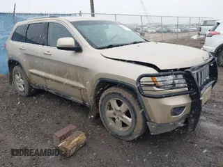 2011 Jeep Grand Cherokee Laredo with VIN 1J4RR4GG9BC563065, listed as a IAAI auction lot 41798136 with 192,149 mi miles. Bid and sale history available at carsss.com. Image 1.