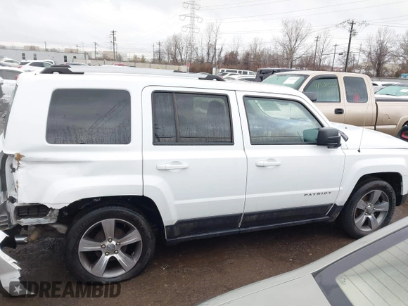 2016 Jeep Patriot Latitude with VIN 1C4NJPFAXGD749306, listed as a IAAI auction lot 41474439 with 94,767 mi miles and . Bid and sale history available at DreamBid. Image 14.
