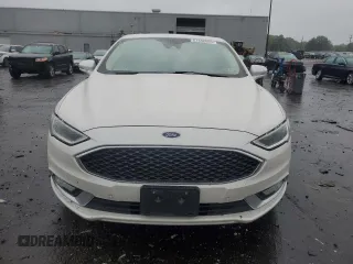 2017 Ford Fusion Titanium z VIN 3FA6P0SUXHR268559, wystawiony jako Copart lot #57456085 z przebiegiem 124 072 mil mil oraz Szkoda całkowita • Salvage title. Historia ofert i sprzedaży dostępna na DreamBid. Obrazek 5.