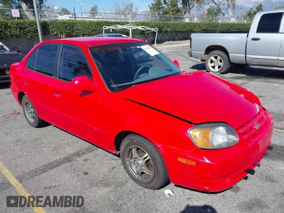 2003 Hyundai Accent GL with VIN KMHCG45C93U487209, listed as a IAAI auction lot 41590636 with 118,811 mi miles. Bid and sale history available at carsss.com. Image 1.