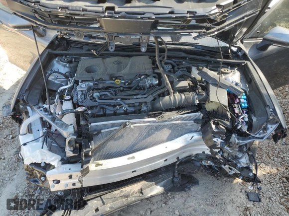 2025 Toyota Camry LE z VIN 4T1DAACK4SU588882, wystawiony jako Copart lot #52717395 z przebiegiem Nie podano mil oraz Szkoda całkowita • Salvage title. Historia ofert i sprzedaży dostępna na DreamBid. Obrazek 12.