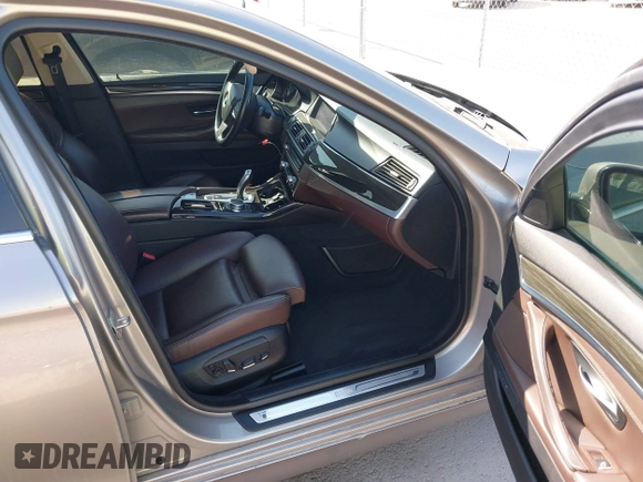2015 BMW 5 Series 535i with VIN WBA5B1C56FG125286, listed as a IAAI auction lot 41747088 with 136,970 mi miles and . Bid and sale history available at carsss.com. Image 5.