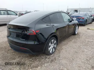 2023 Tesla Model Y Long Range z VIN 7SAYGDEEXPA181114, wystawiony jako IAAI lot #41564617 z przebiegiem 64 990 mil mil oraz . Historia ofert i sprzedaży dostępna na DreamBid. Obrazek 4.