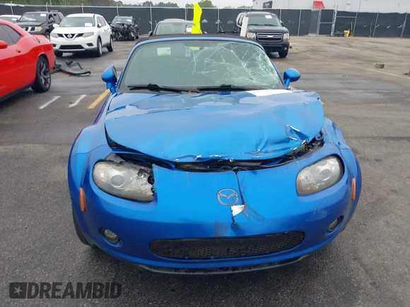 2006 Mazda MX-5 Miata Touring z VIN JM1NC25FX60102209, wystawiony jako IAAI lot #41940771 z przebiegiem 165 003 mil mil oraz . Historia ofert i sprzedaży dostępna na DreamBid. Obrazek 11.