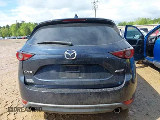 2018 Mazda CX-5 Grand Touring z VIN JM3KFADM8J1406007, wystawiony jako IAAI lot #42008567 z przebiegiem 110 661 mil mil oraz . Historia ofert i sprzedaży dostępna na DreamBid. Obrazek 16.