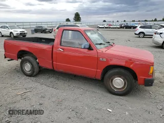 1988 GMC Sonoma with VIN 1GTBS14E2J2539806, listed as a Copart auction lot 71105184 with 141,085 mi miles and Salvage Title. Bid and sale history available at DreamBid. Image 4.