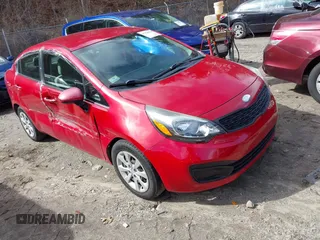 2014 Kia Rio LX with VIN KNADM4A31E6370963, listed as a IAAI auction lot 41720980 with 112,551 mi miles and . Bid and sale history available at DreamBid. Image 1.
