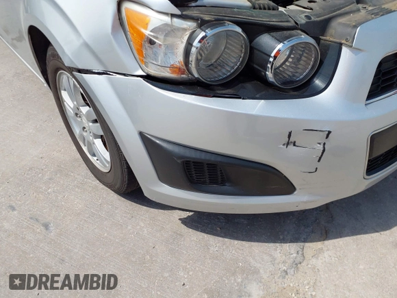 2014 Chevrolet Sonic LT with VIN 1G1JC5SH0E4210327, listed as a IAAI auction lot 42069313 with 94,506 mi miles and . Bid and sale history available at DreamBid. Image 6.